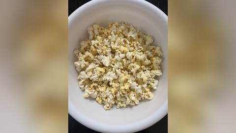 Plain popcorn in a white bowl