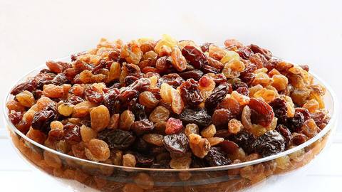 A glass dish of raisins