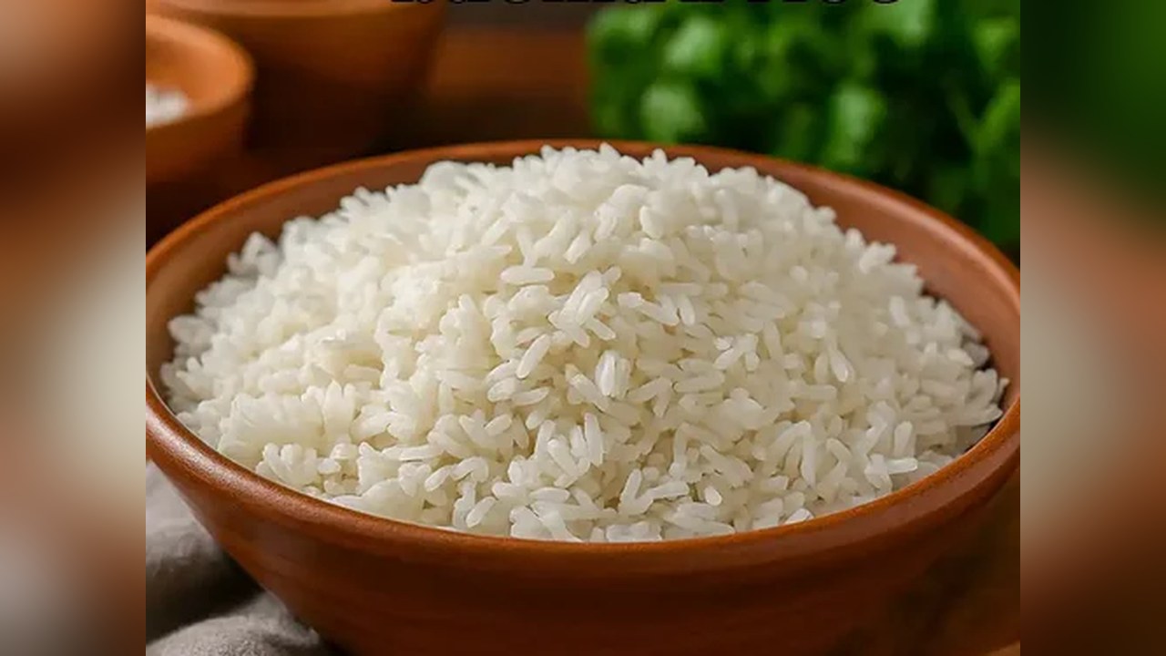 A small silver dish of cooked white rice