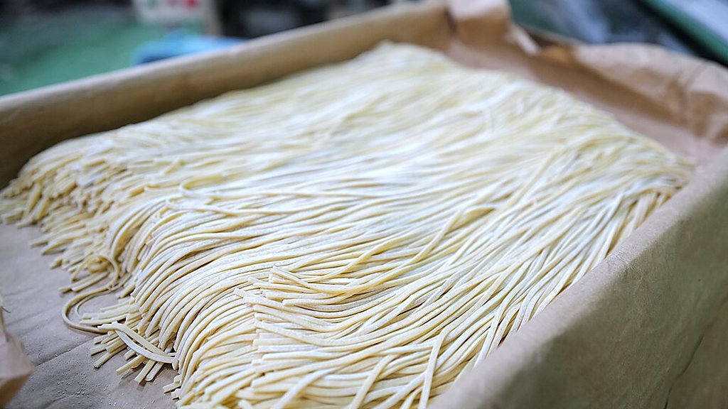 Fresh noodles laid out in a box